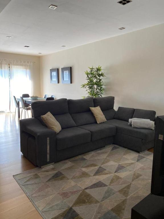 a living room with a couch and a table at Villa CL in Vila do Conde