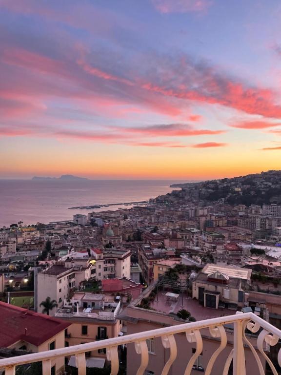 a view of a city at sunset at Attico Paradiso in Naples