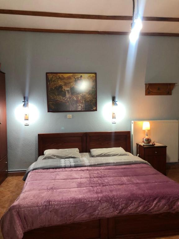 Postel nebo postele na pokoji v ubytování Alexandros Guesthouse