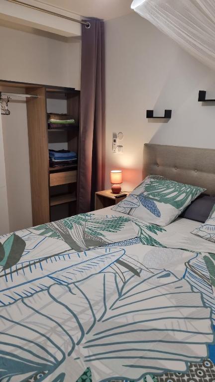 Postel nebo postele na pokoji v ubytování Les hauts du fromager