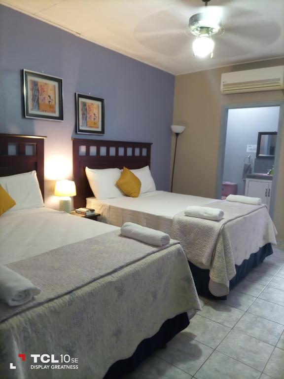 Postel nebo postele na pokoji v ubytování Hotel Vista del Mar