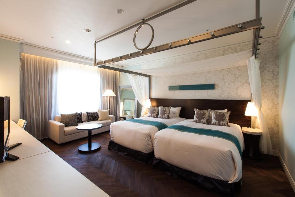 Łóżko lub łóżka w pokoju w obiekcie Nagoya Tokyu Hotel