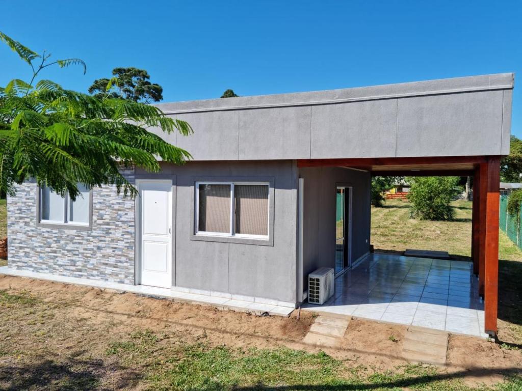 a modular home with a garage and a house at ITURANCH in Ituzaingó