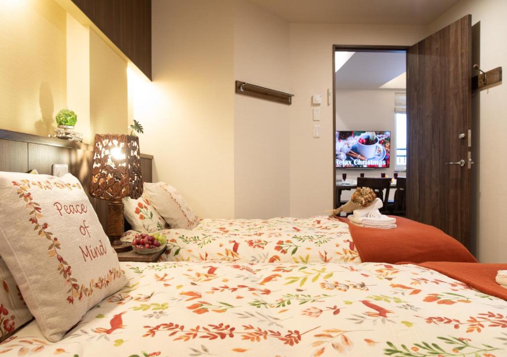 Postel nebo postele na pokoji v ubytování Miidokoro House Hotel
