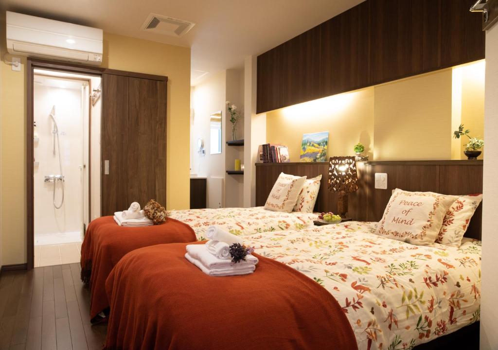 Postel nebo postele na pokoji v ubytování Miidokoro House Hotel
