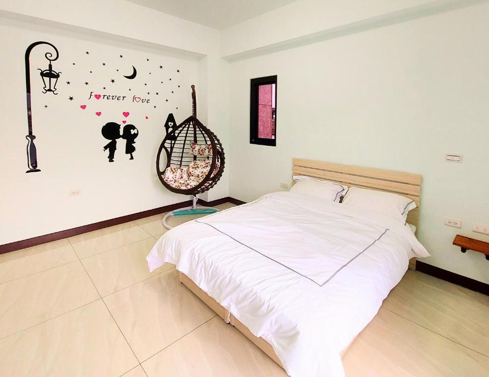 Postel nebo postele na pokoji v ubytování Xian Jing B&B