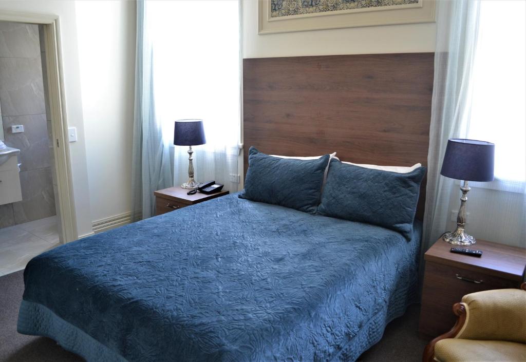 Postel nebo postele na pokoji v ubytování Brydone Hotel Oamaru