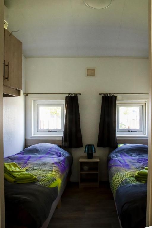 Postel nebo postele na pokoji v ubytování luxe cottage knokke heist