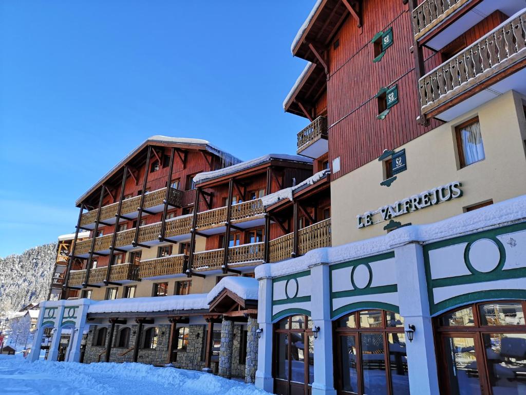 a hotel in the mountains with snow on the ground at Valfréjus- Hôtel club Le Valfréjus in Valfréjus