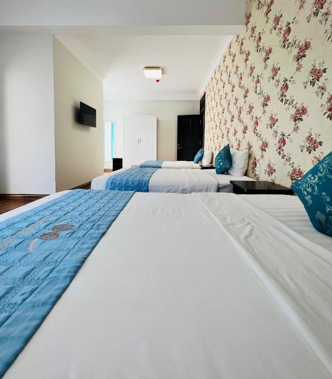 Giường trong phòng chung tại Dalat Eco Hotel