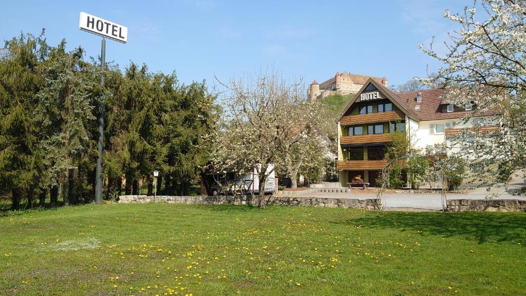 a street sign in front of a house at Hotel Landgasthof Fromm in Untergruppenbach