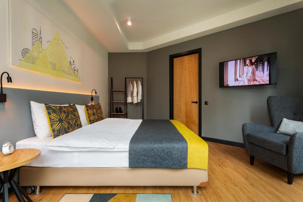 Postel nebo postele na pokoji v ubytování Citadines City Centre Tbilisi