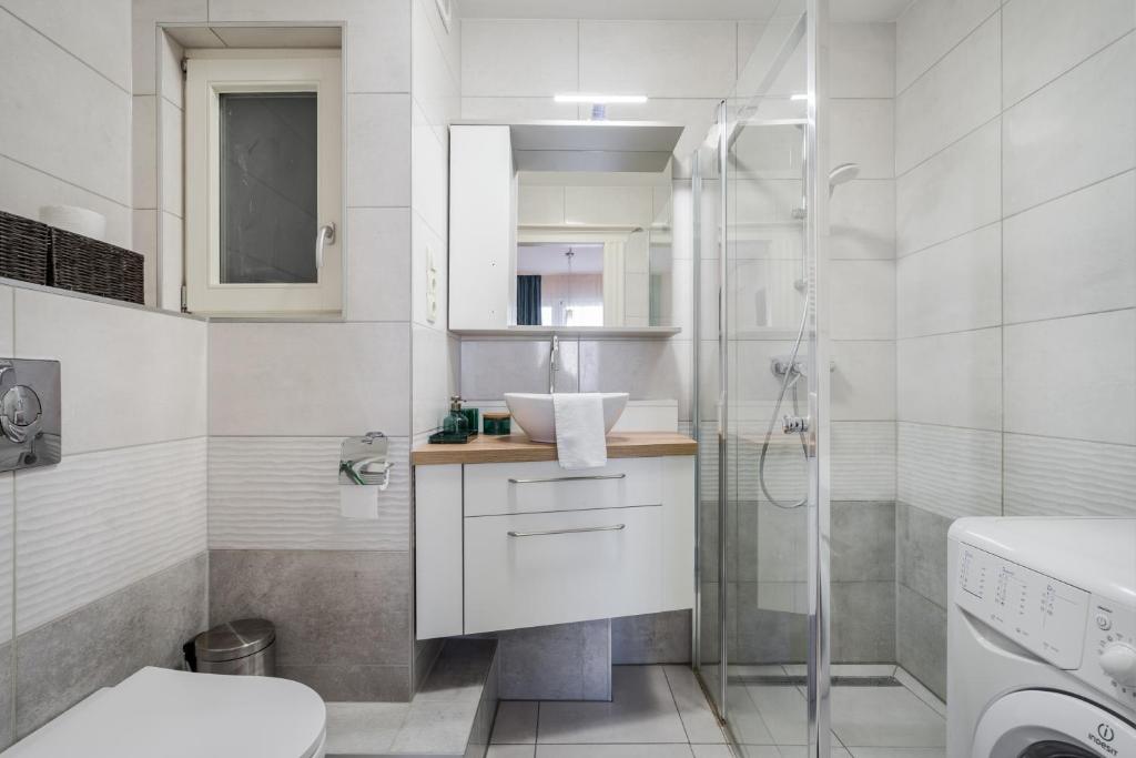 A bathroom at BpR Blue Paradise Apartment with A/C