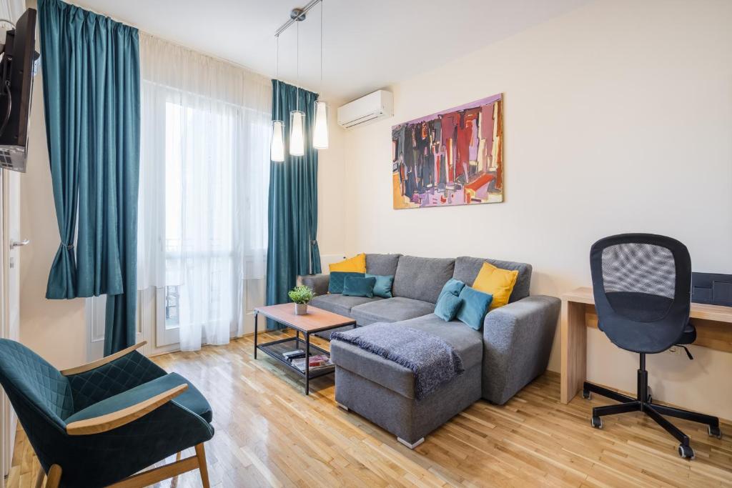 A seating area at BpR Blue Paradise Apartment with A/C