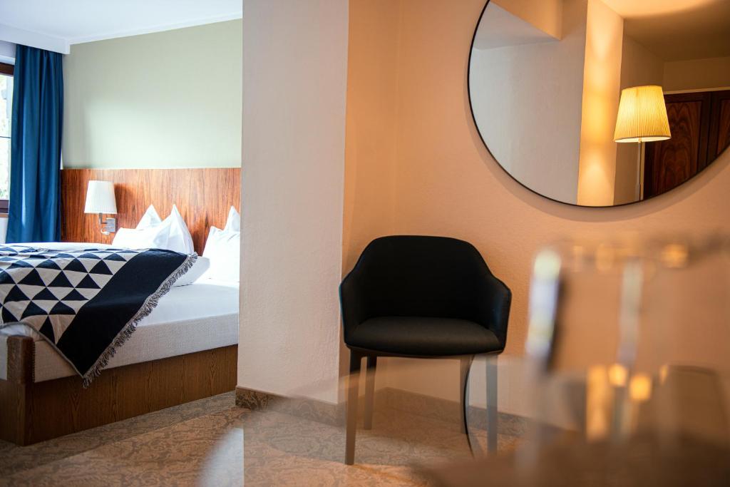 Postel nebo postele na pokoji v ubytování Unterwirt - Das kleine Gourmethotel