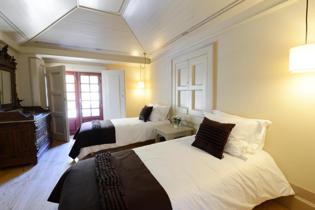 Cama ou camas em um quarto em Casa de Docim