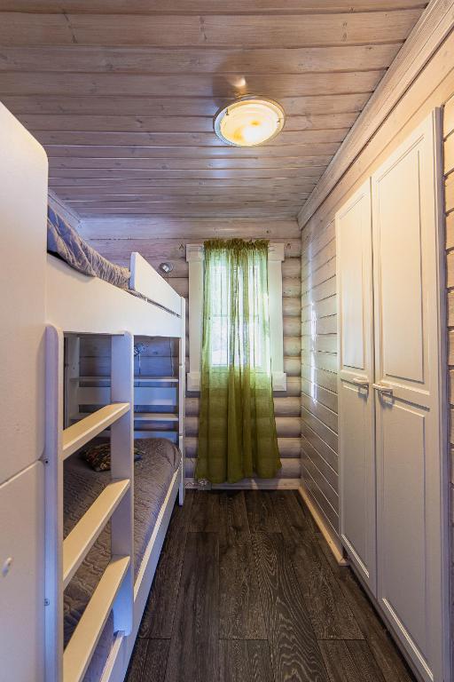 Кровать или кровати в номере Villa Kurpitsa at MESSILA ski & camping
