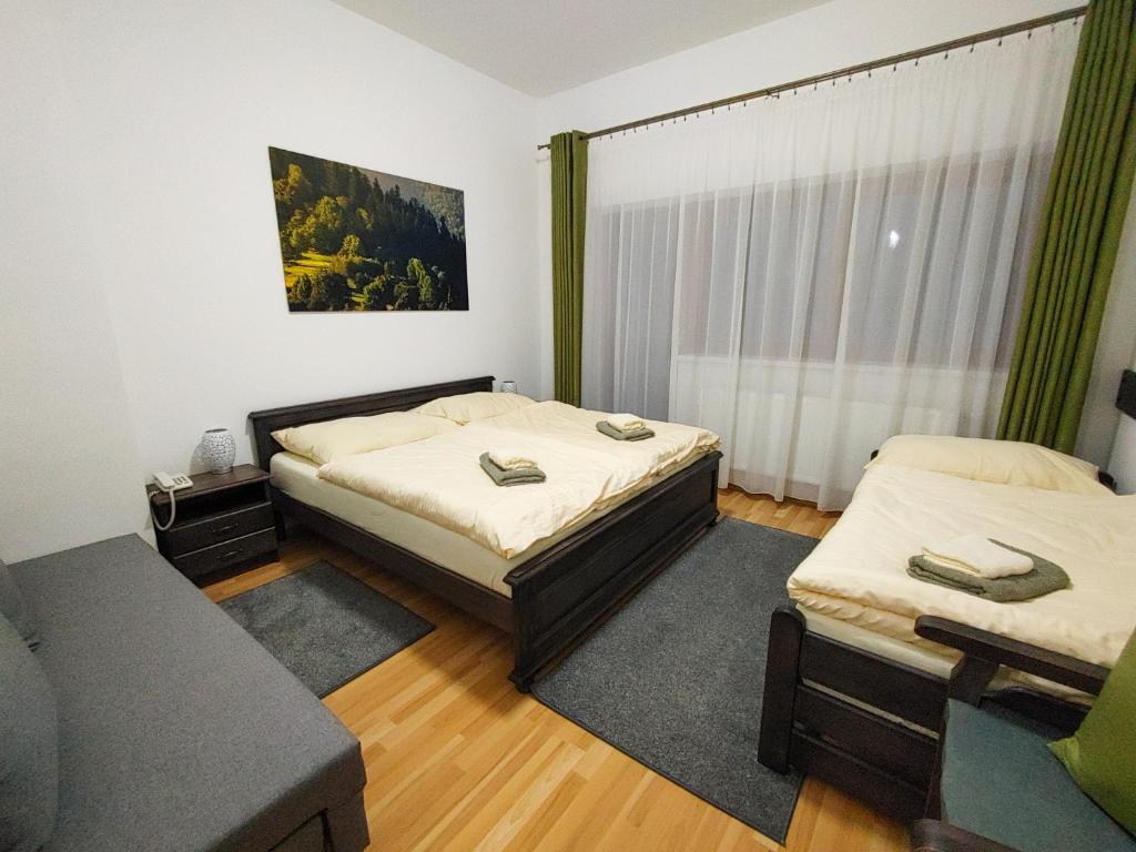 Postel nebo postele na pokoji v ubytování Penzión Solisko*** Oščadnica