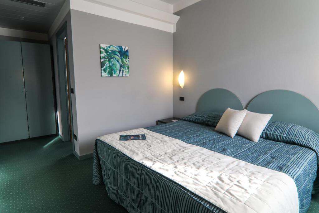 Postel nebo postele na pokoji v ubytování Hotel Vittoria