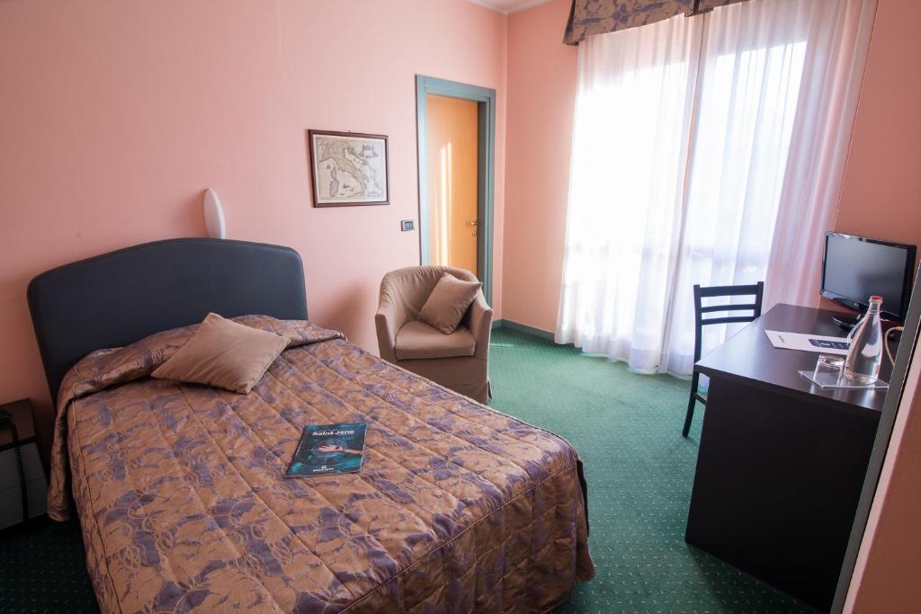 Postel nebo postele na pokoji v ubytování Hotel Vittoria