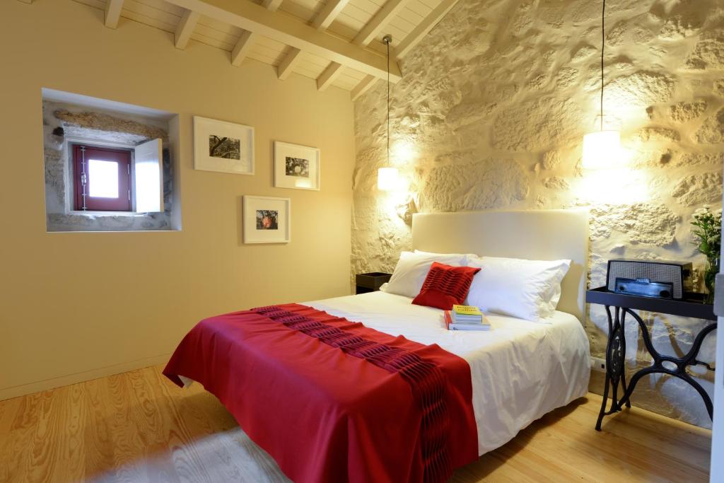 Cama ou camas em um quarto em Casa de Docim
