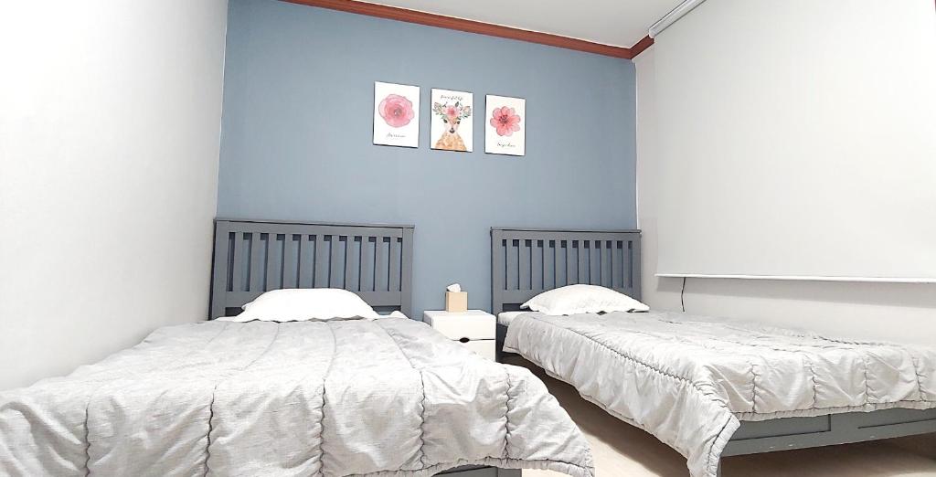 Postel nebo postele na pokoji v ubytování Healinghouse Peakjang