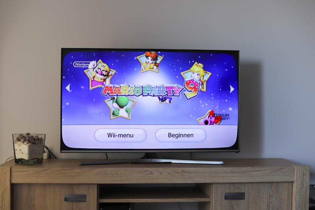TV a/nebo společenská místnost v ubytování Huize Oesjoe