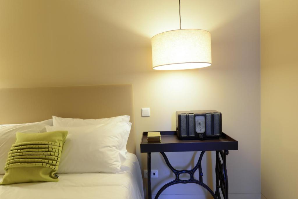 Cama ou camas em um quarto em Casa de Docim
