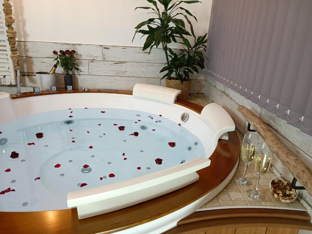 a bath tub with hearts on it in a room at Le Maréchal Duplex - Appartement avec Jacuzzi - CAEN hyper Centre in Caen