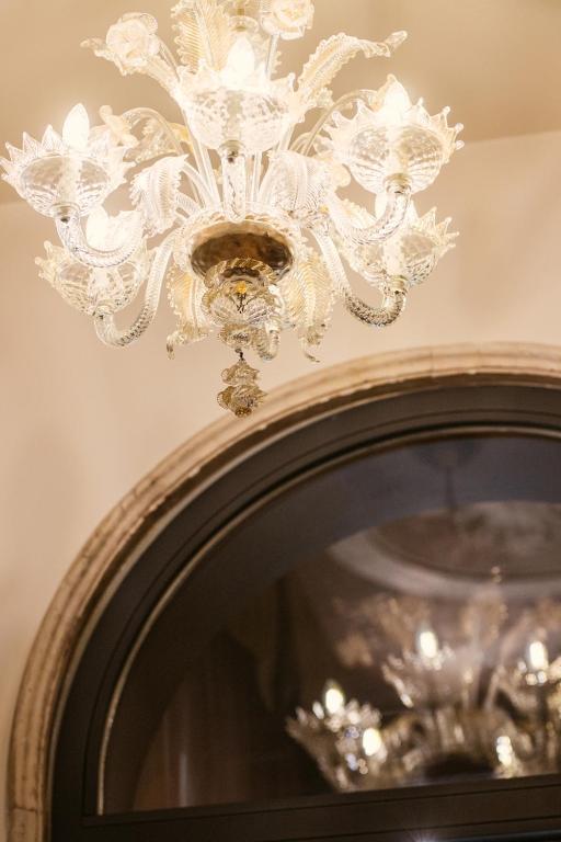 a chandelier hanging from a ceiling at Palazzo Barocci in Venice