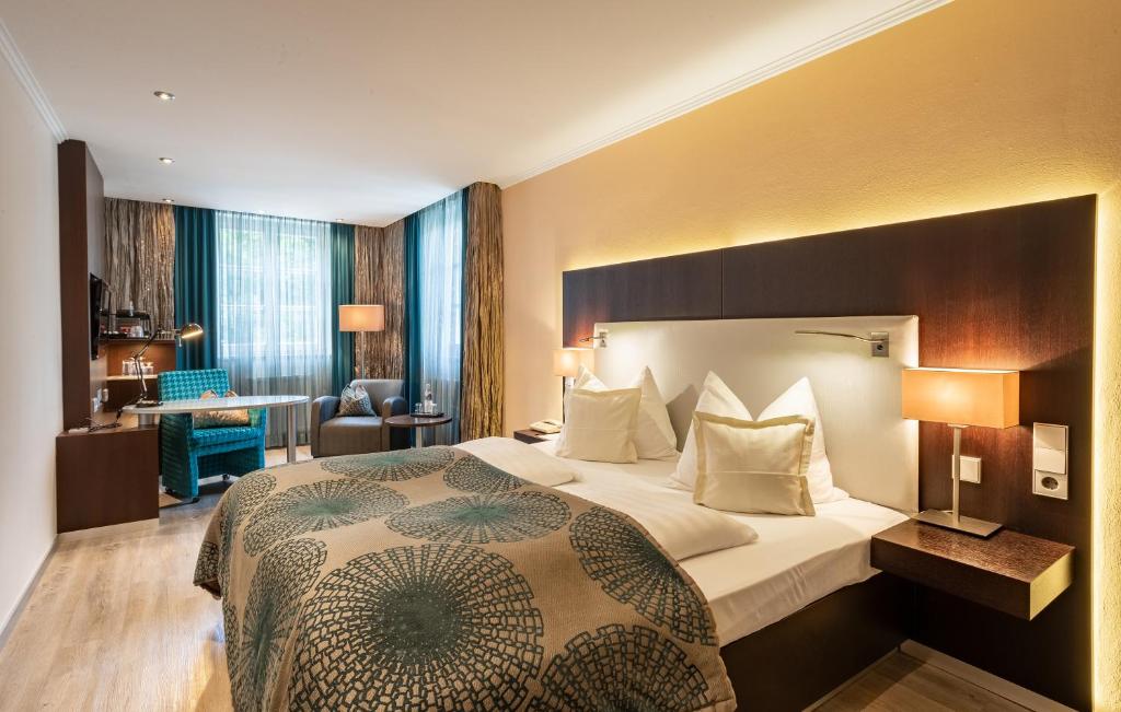 Postel nebo postele na pokoji v ubytování Hotel Residenz Passau