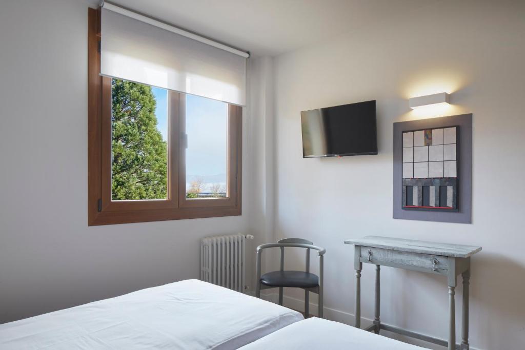 Postel nebo postele na pokoji v ubytování Hostal Rural Aritzalko