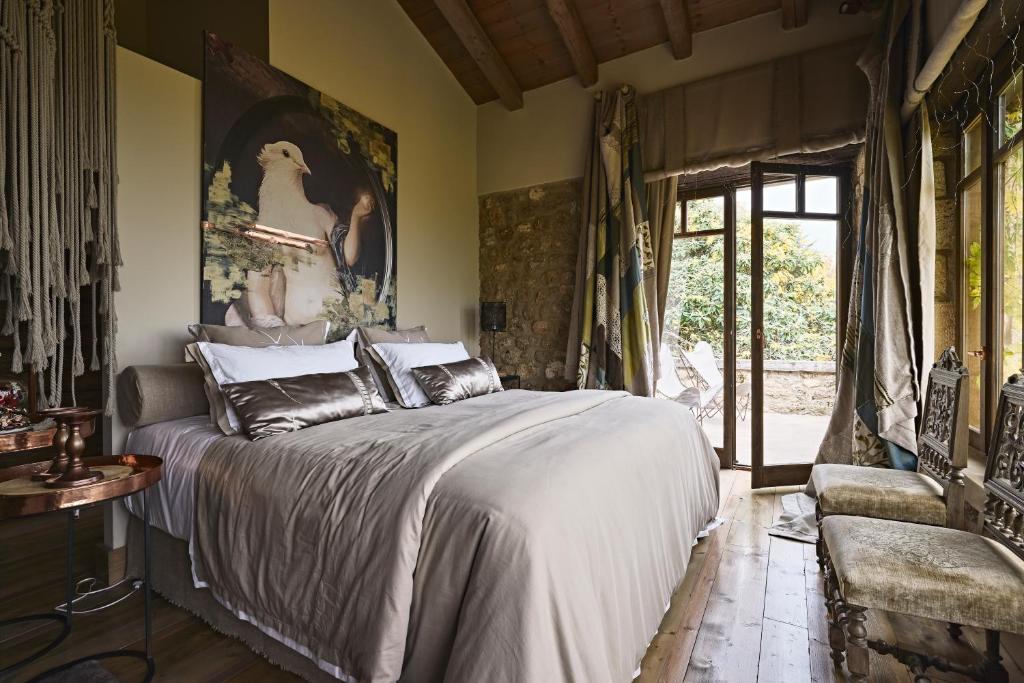 Postel nebo postele na pokoji v ubytování Area Synest Nature Suites