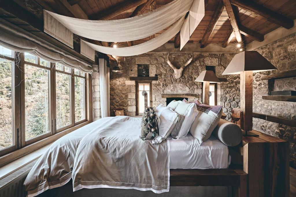 Postel nebo postele na pokoji v ubytování Area Synest Nature Suites