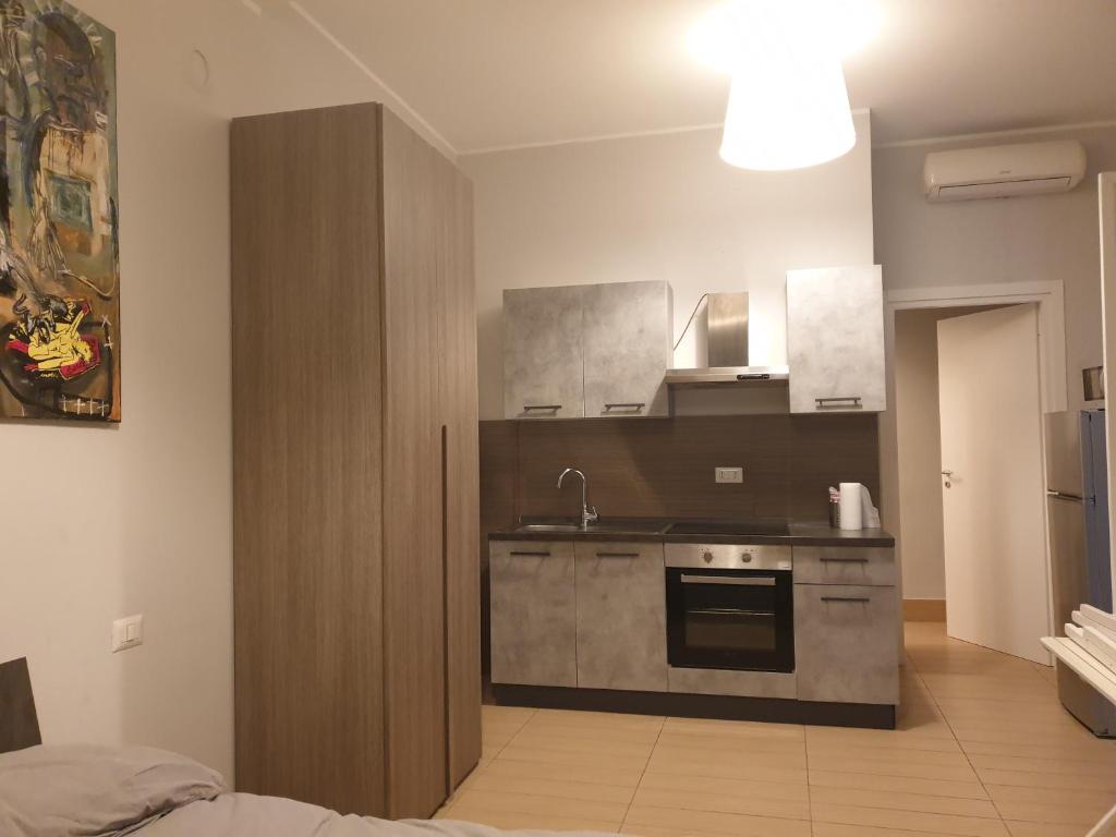 Kuchyň nebo kuchyňský kout v ubytování Michelangelo Apartments con parcheggio gratuito in loco e self check in