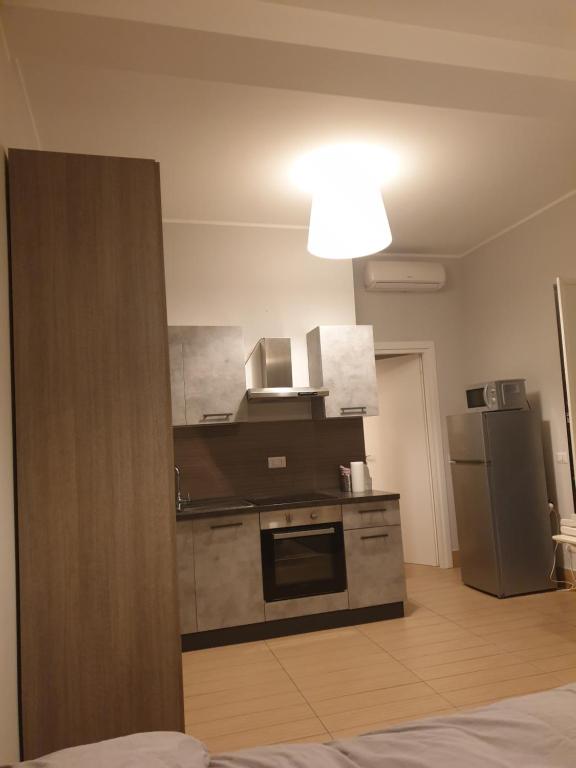 Kuchyň nebo kuchyňský kout v ubytování Michelangelo Apartments con parcheggio gratuito in loco e self check in