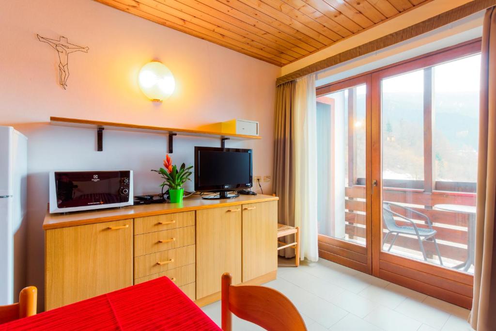 TV a/nebo společenská místnost v ubytování Residence Diamant