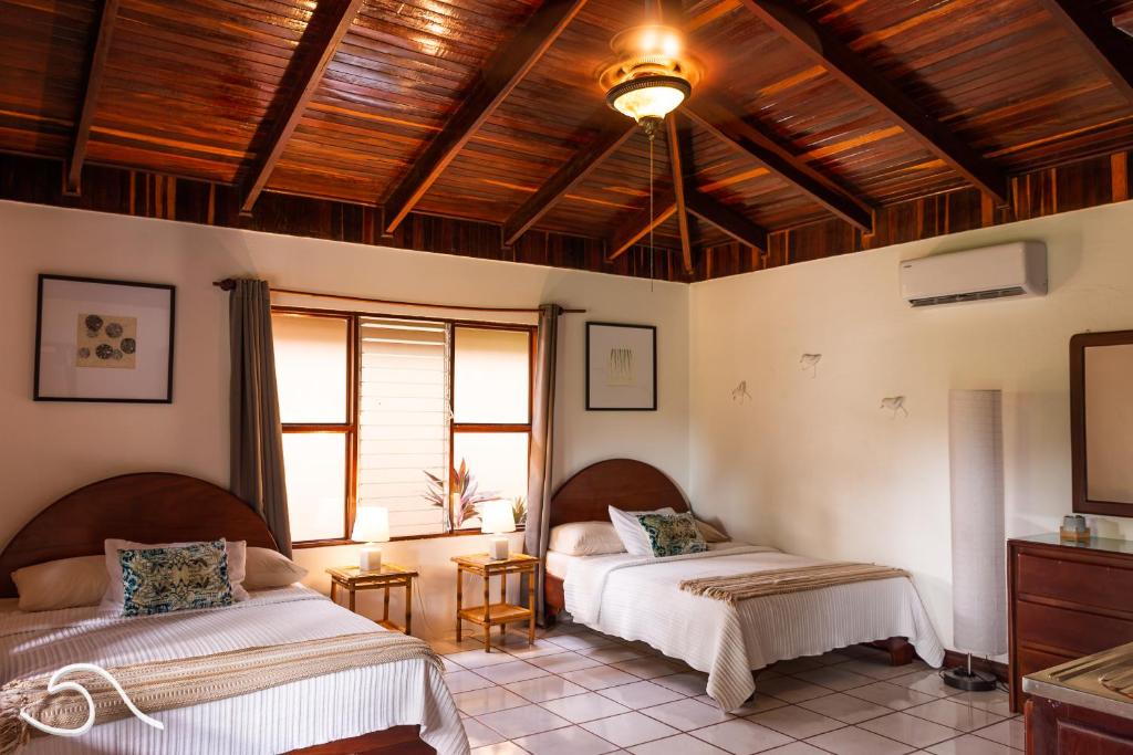 Postel nebo postele na pokoji v ubytování Tranquilidad Resort