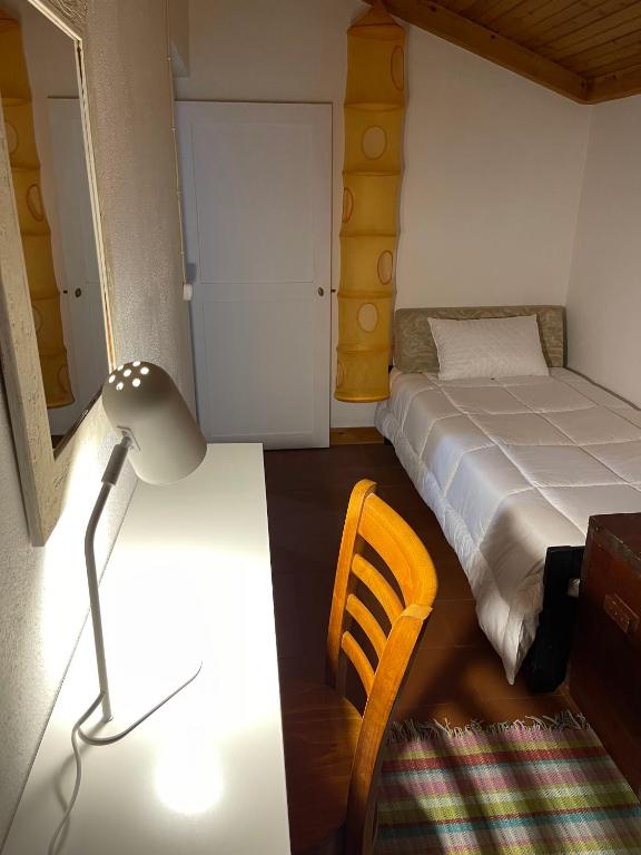 Postel nebo postele na pokoji v ubytování Casa do Bicho Pau