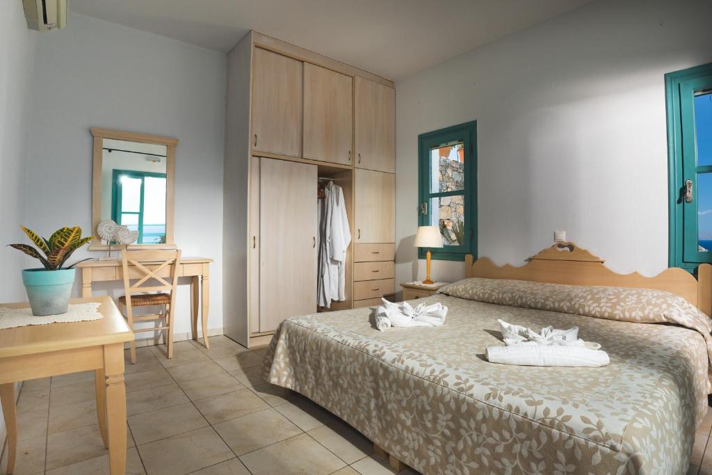 Postel nebo postele na pokoji v ubytování Mohlos Villas