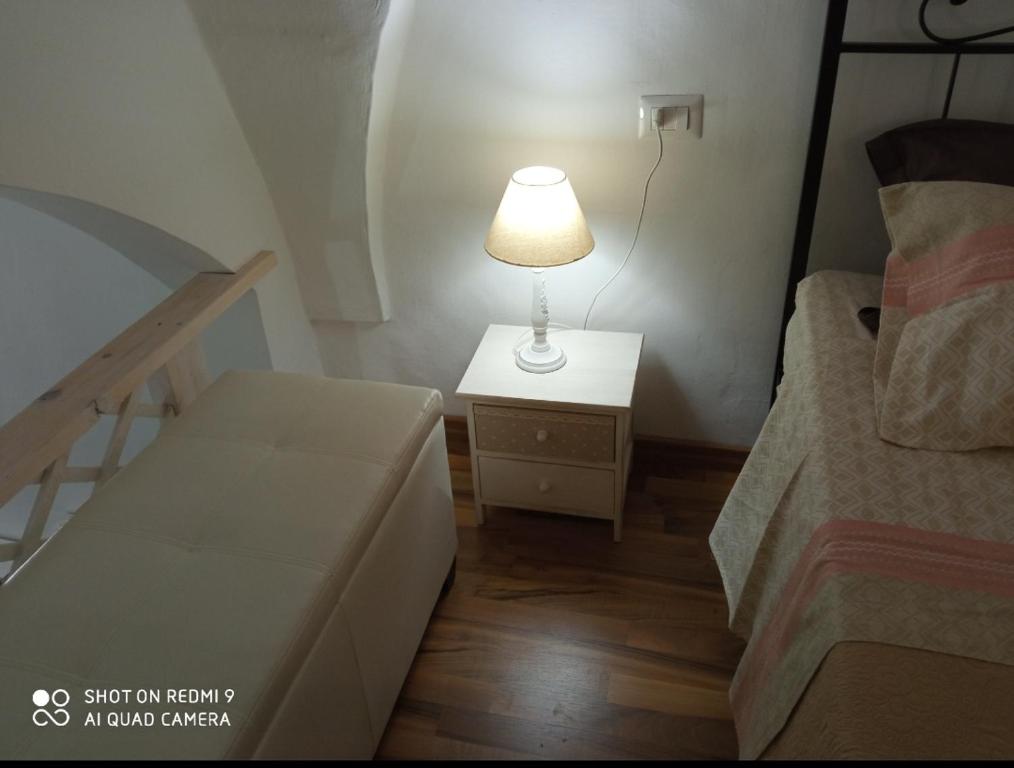 Postel nebo postele na pokoji v ubytování Il Nido della Calandra