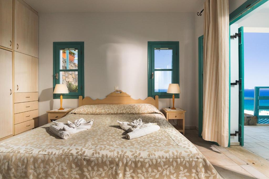 Postel nebo postele na pokoji v ubytování Mohlos Villas