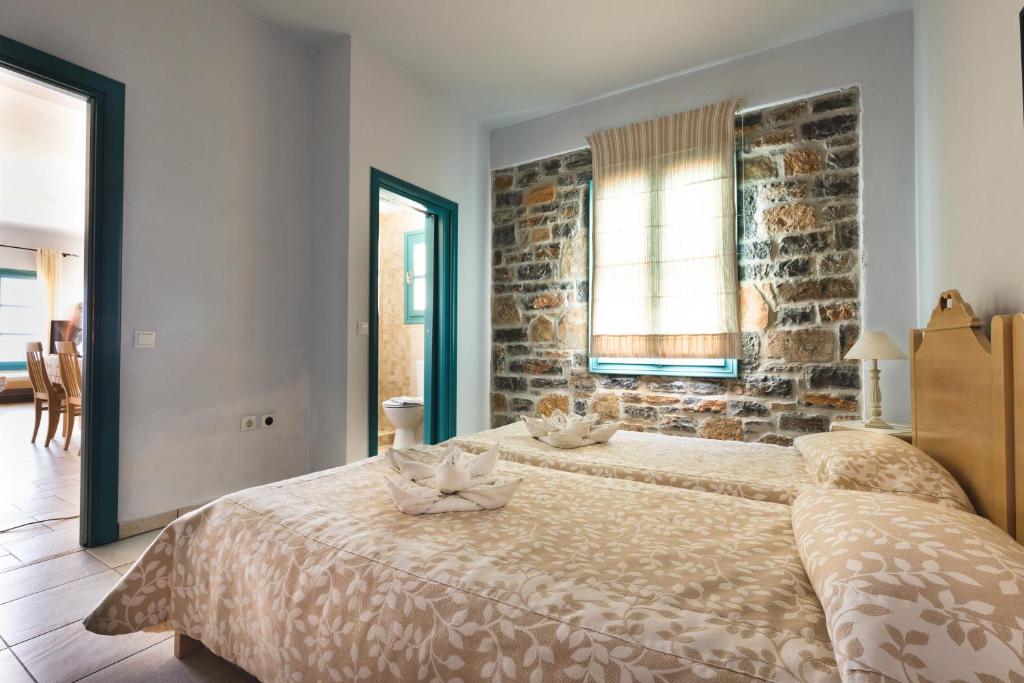 Postel nebo postele na pokoji v ubytování Mohlos Villas