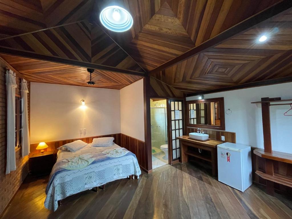 Ένα ή περισσότερα κρεβάτια σε δωμάτιο στο Pousada Solar Das Águas, S/N