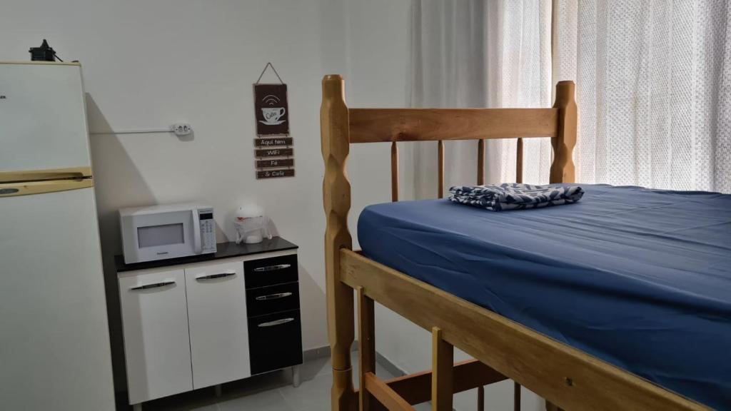 Ein Bett oder Betten in einem Zimmer der Unterkunft Hospedaria Canto Ubuntu Kitnet