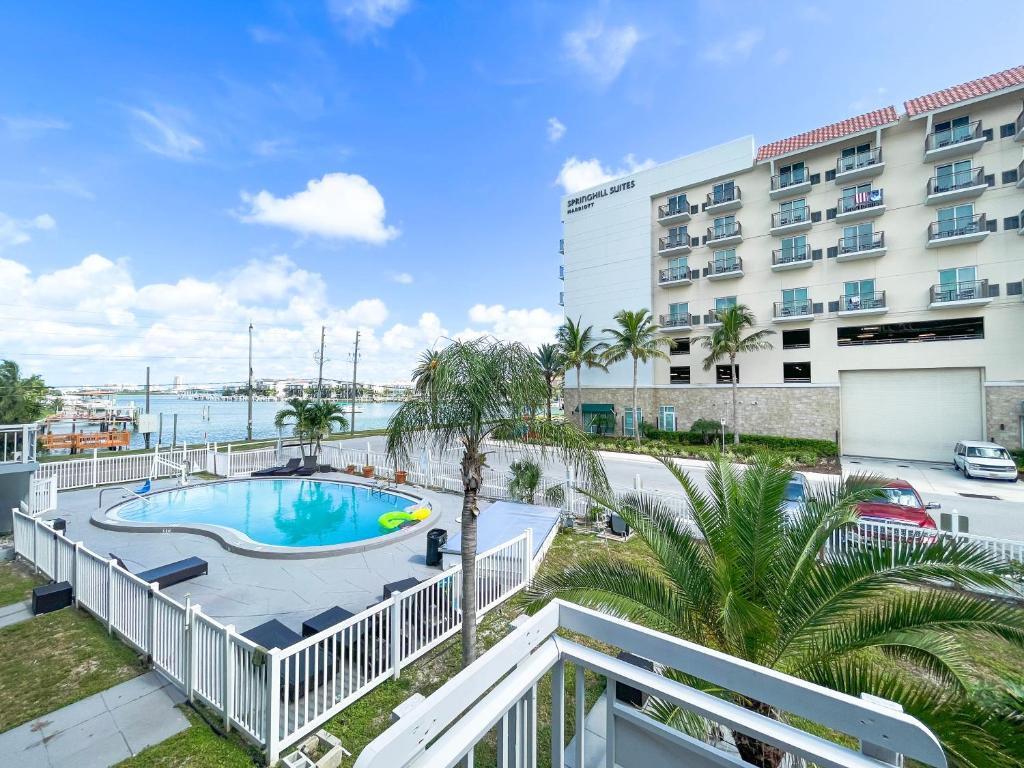 a view of the pool from the balcony of a hotel at Sunrise Resort Motel South in Clearwater Beach