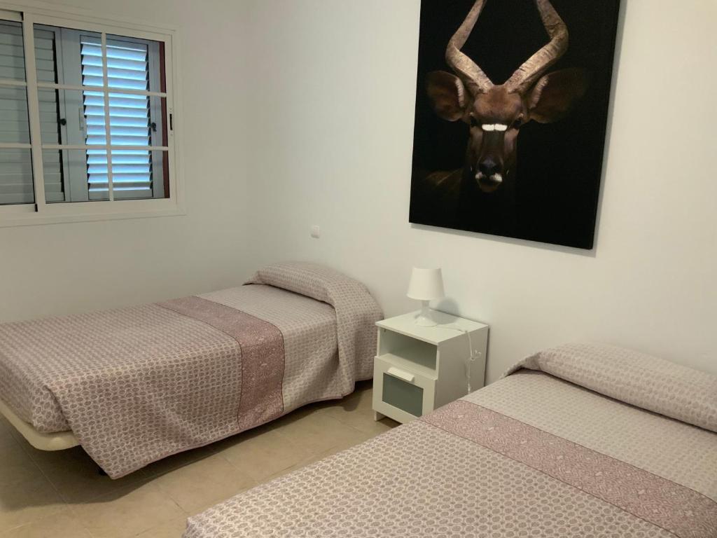 Postel nebo postele na pokoji v ubytování Duplex en Meloneras