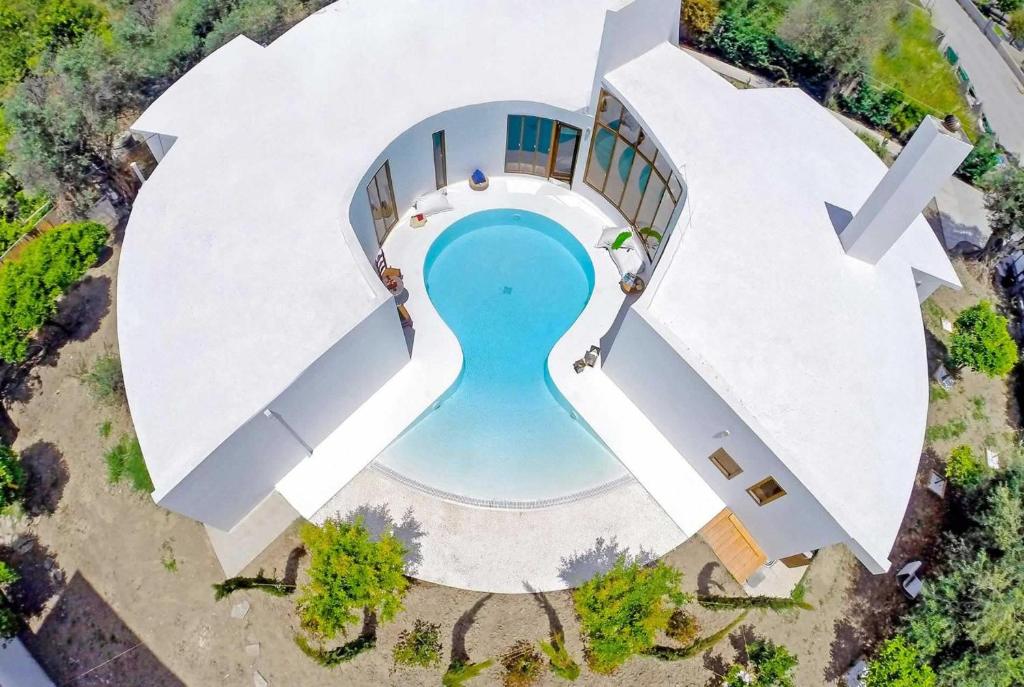 an overhead view of a swimming pool in a building at Panacea in Rhodes Town