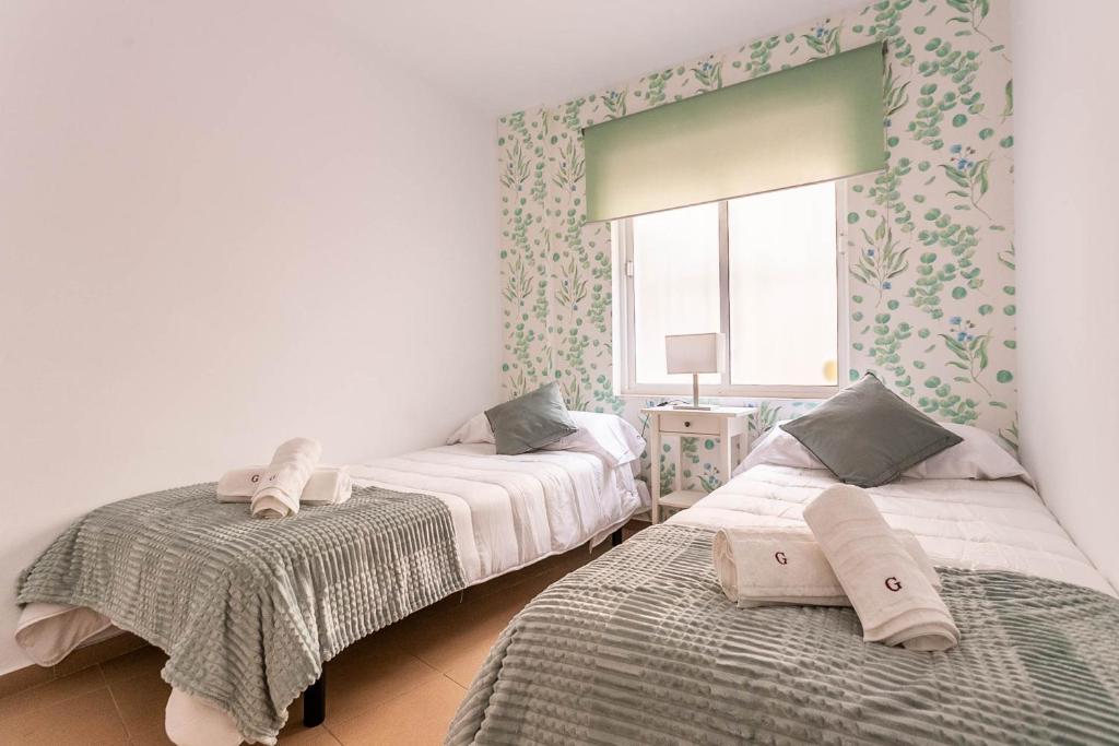 Postel nebo postele na pokoji v ubytování Goyeneta Luxury Suite