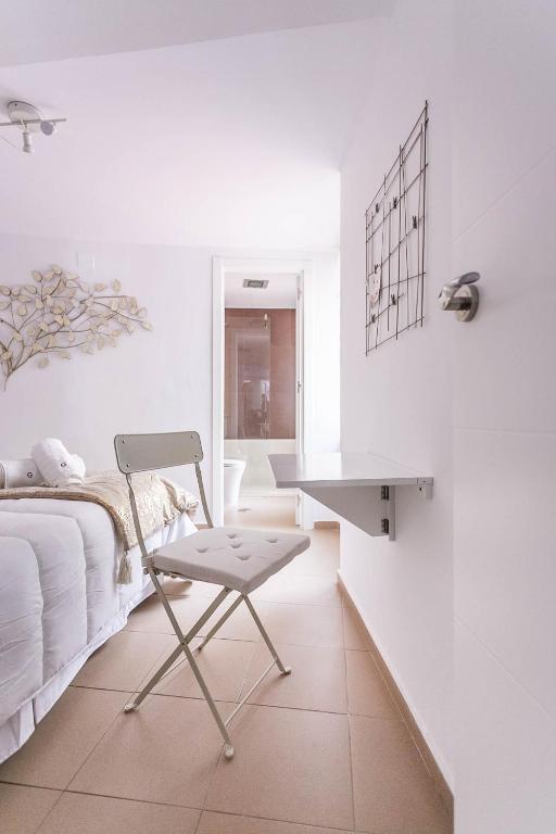 Postel nebo postele na pokoji v ubytování Goyeneta Luxury Suite